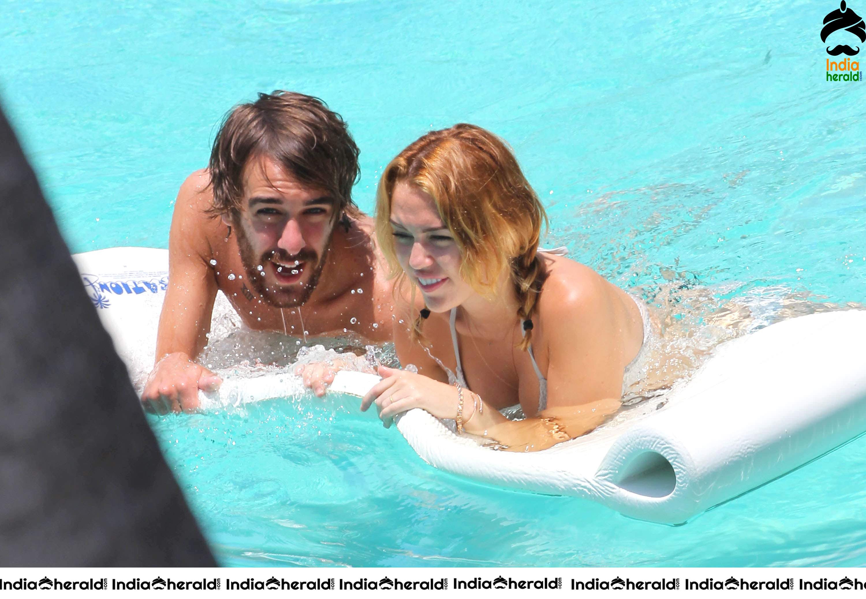 Miley Cyrus caught in Bikini while chilling by Pool Set 1