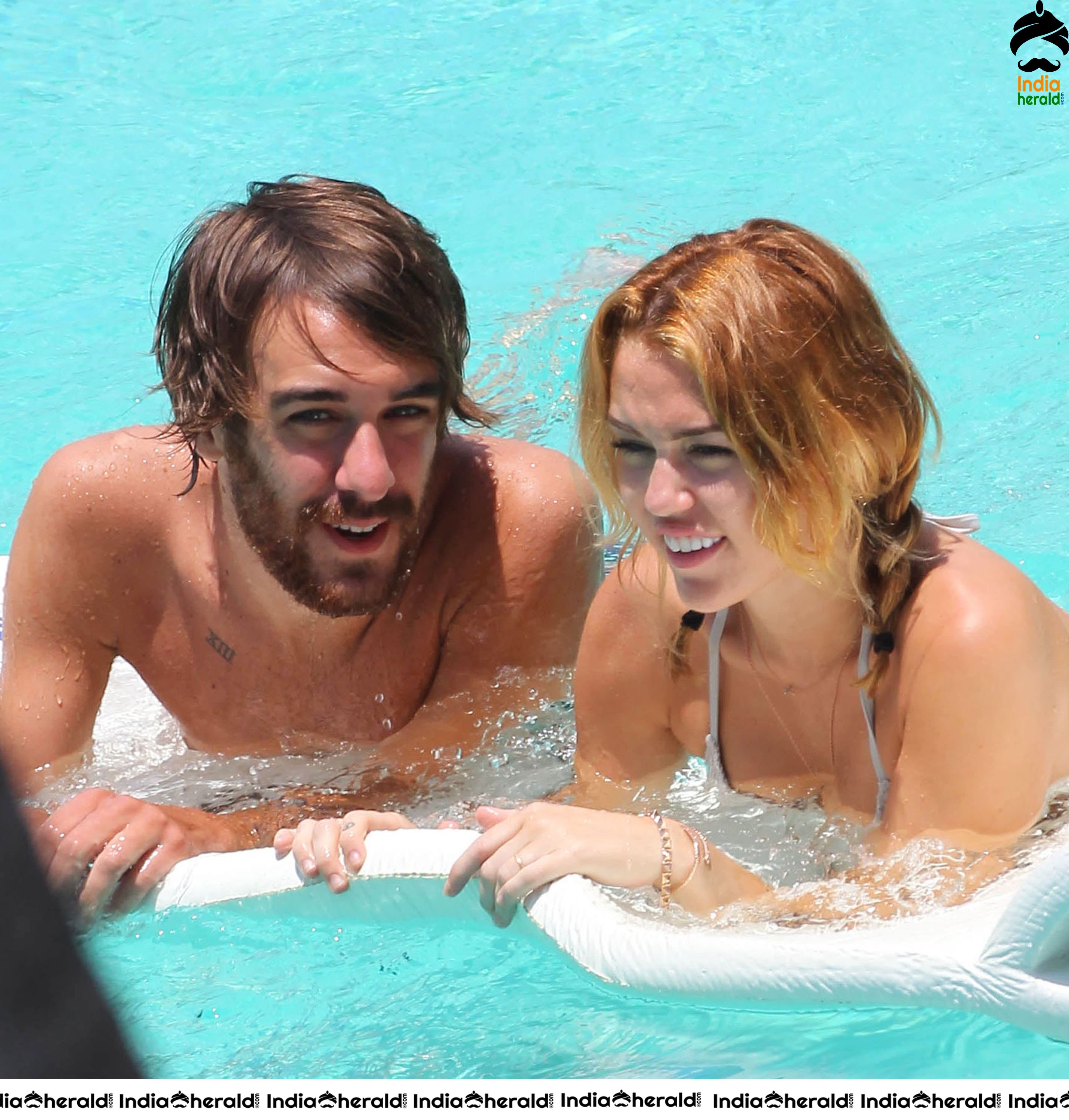 Miley Cyrus caught in Bikini while chilling by Pool Set 2