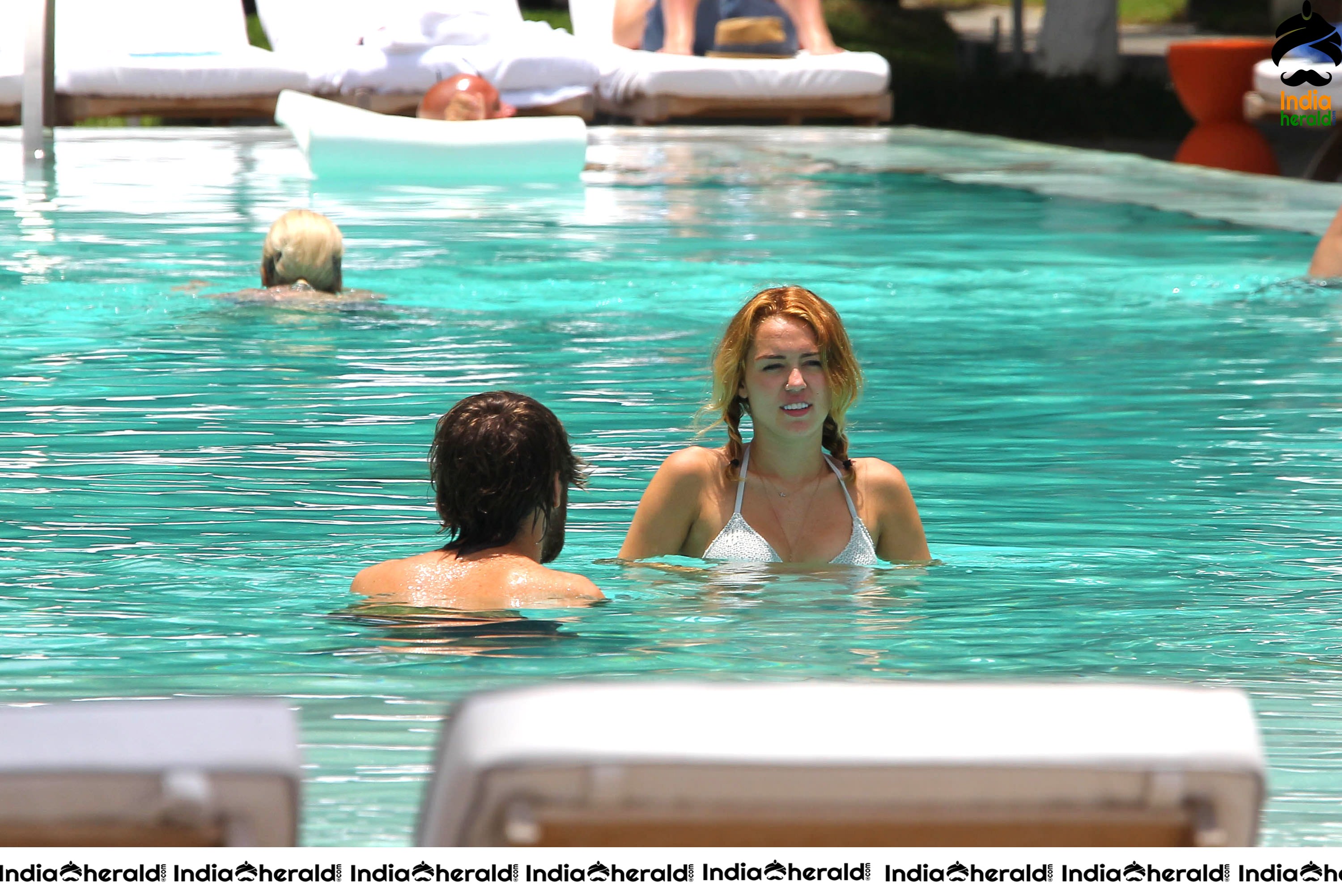 Miley Cyrus caught in Bikini while chilling by Pool Set 2