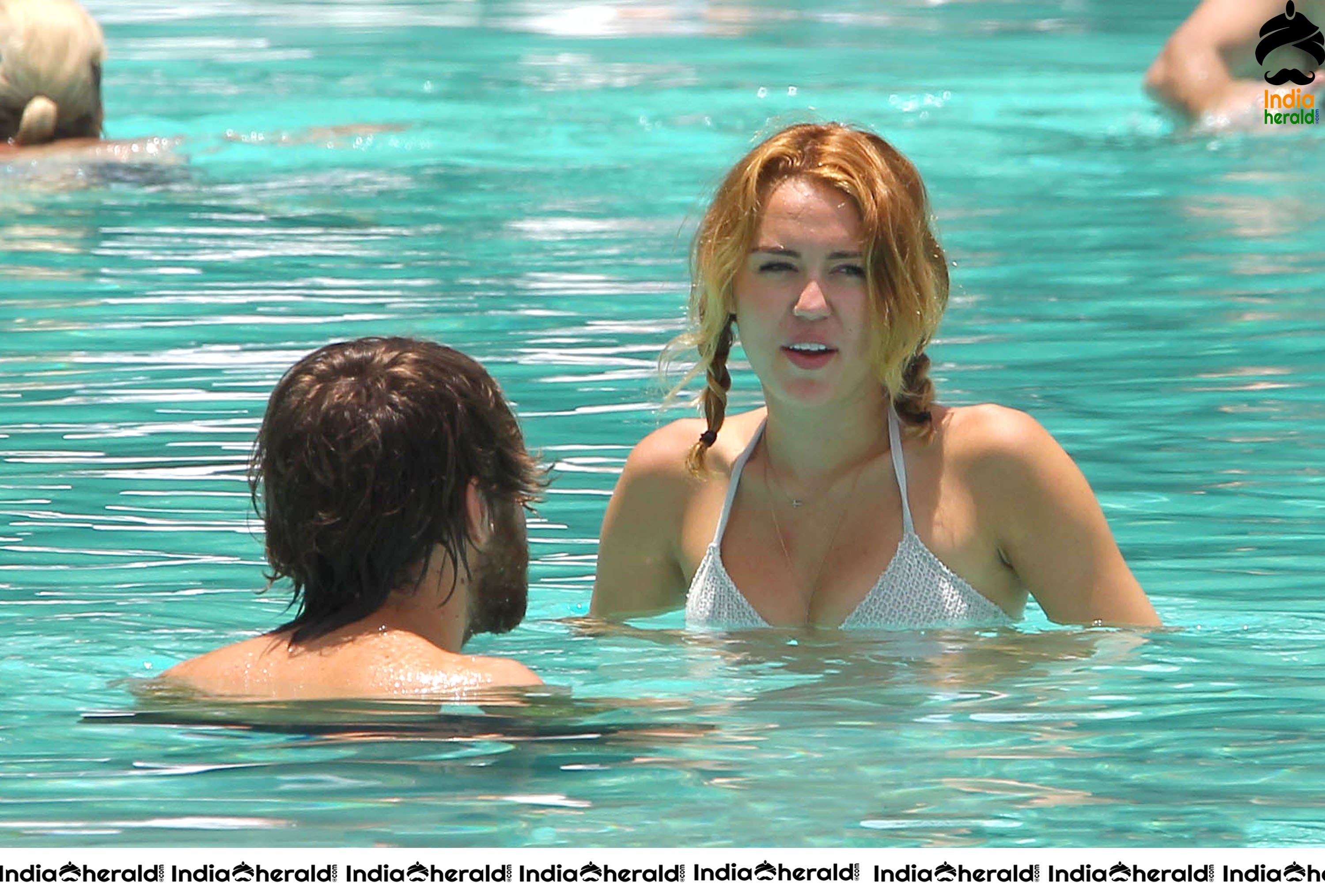 Miley Cyrus caught in Bikini while chilling by Pool Set 2