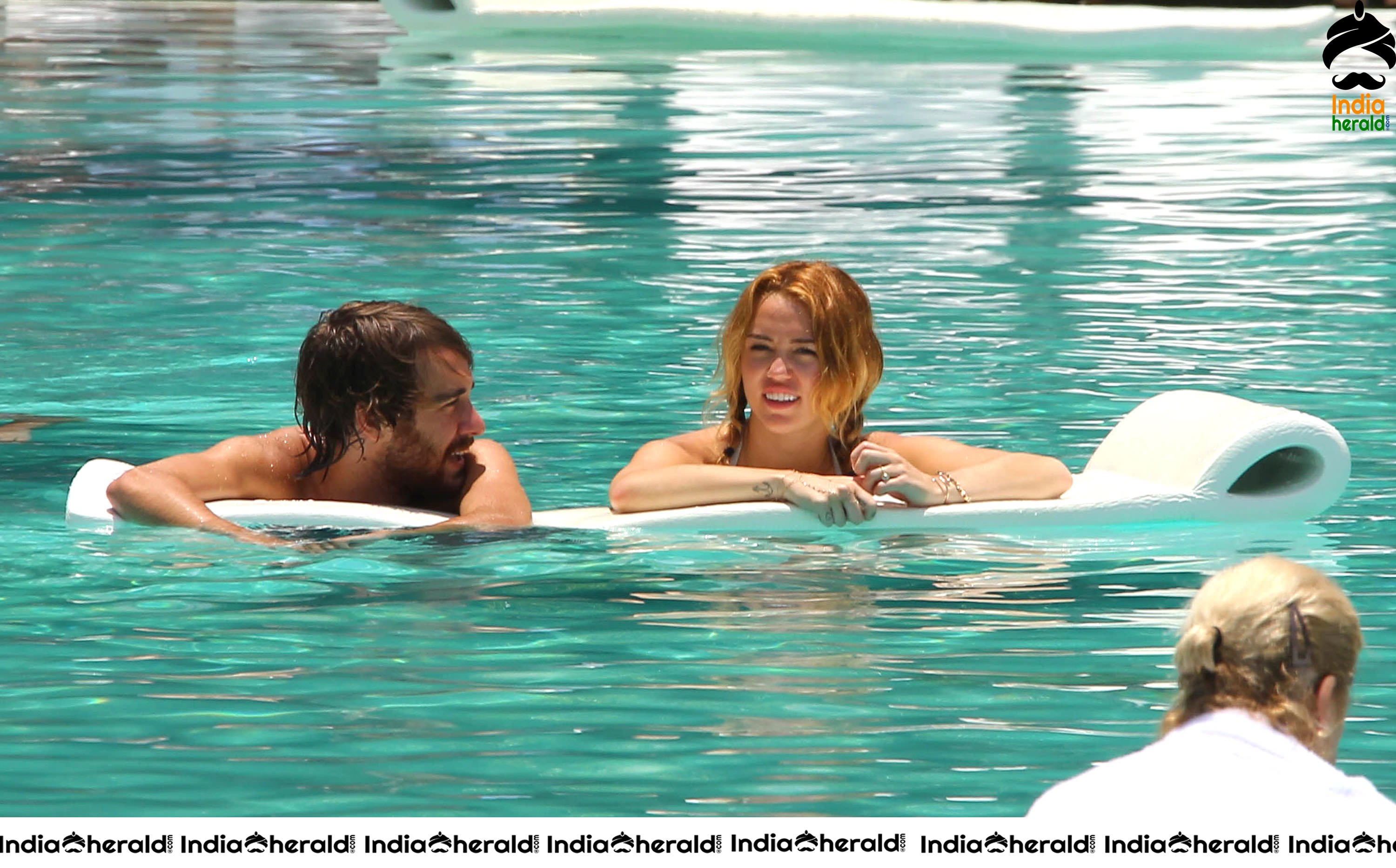 Miley Cyrus caught in Bikini while chilling by Pool Set 2