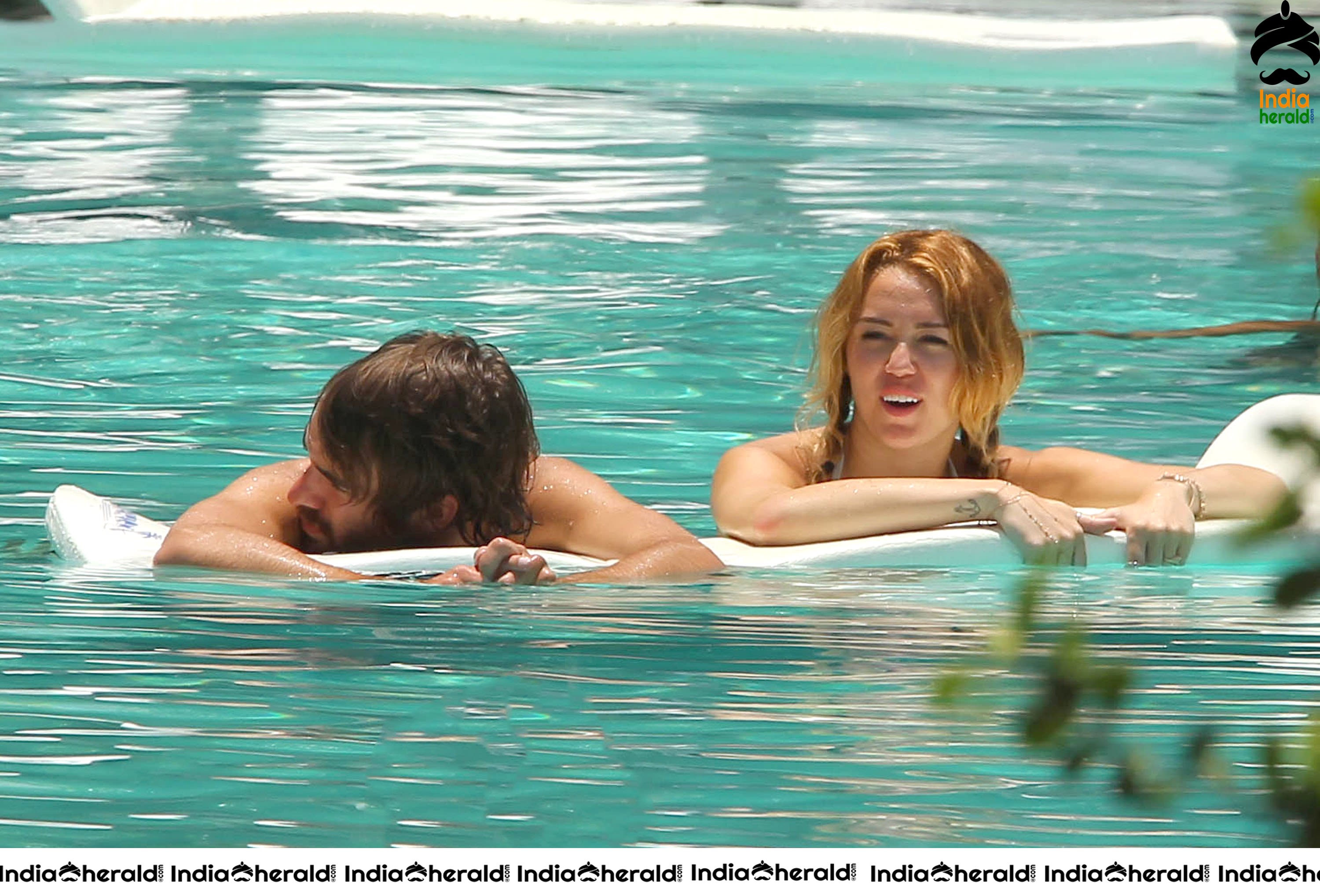 Miley Cyrus caught in Bikini while chilling by Pool Set 2