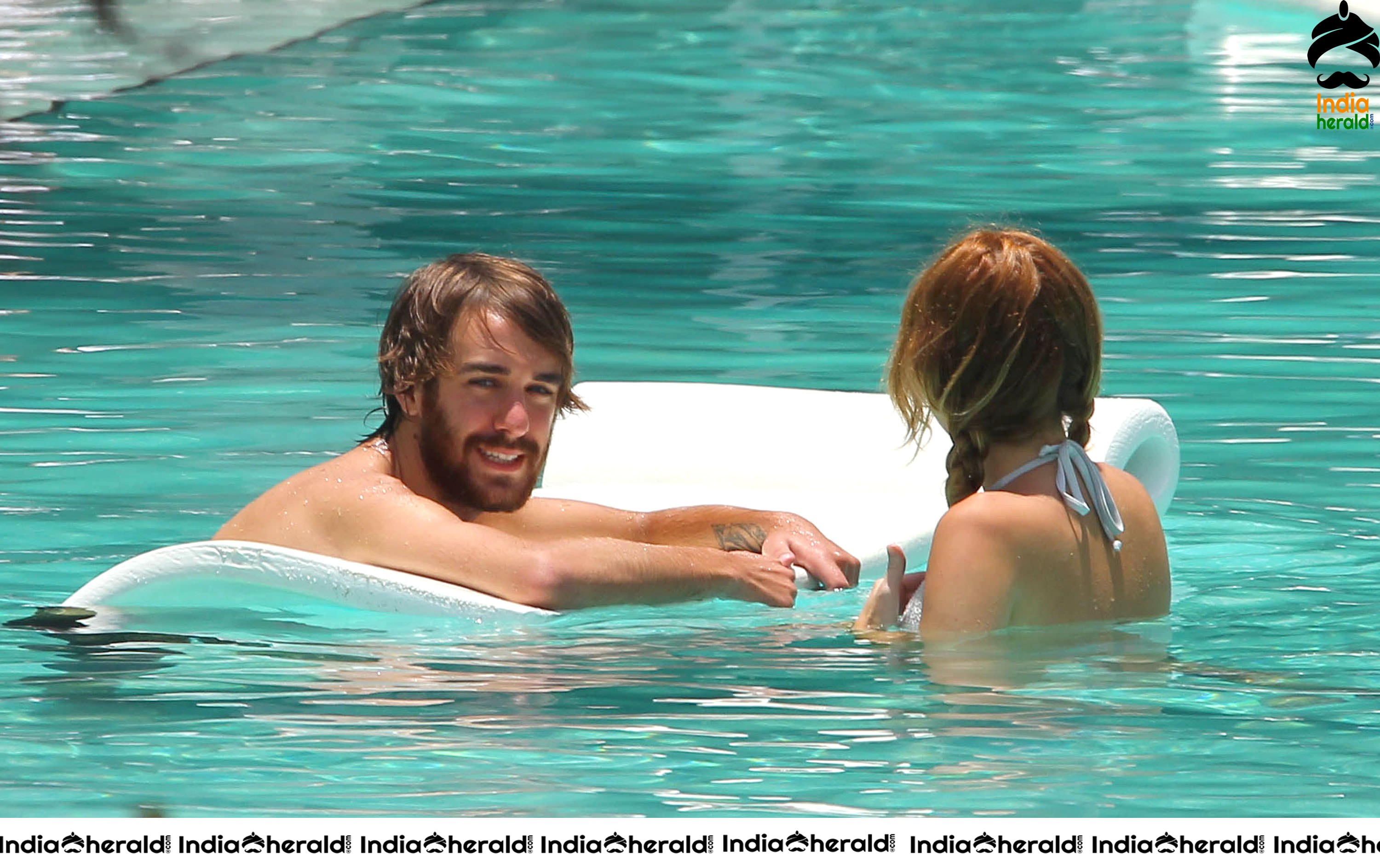 Miley Cyrus caught in Bikini while chilling by Pool Set 2
