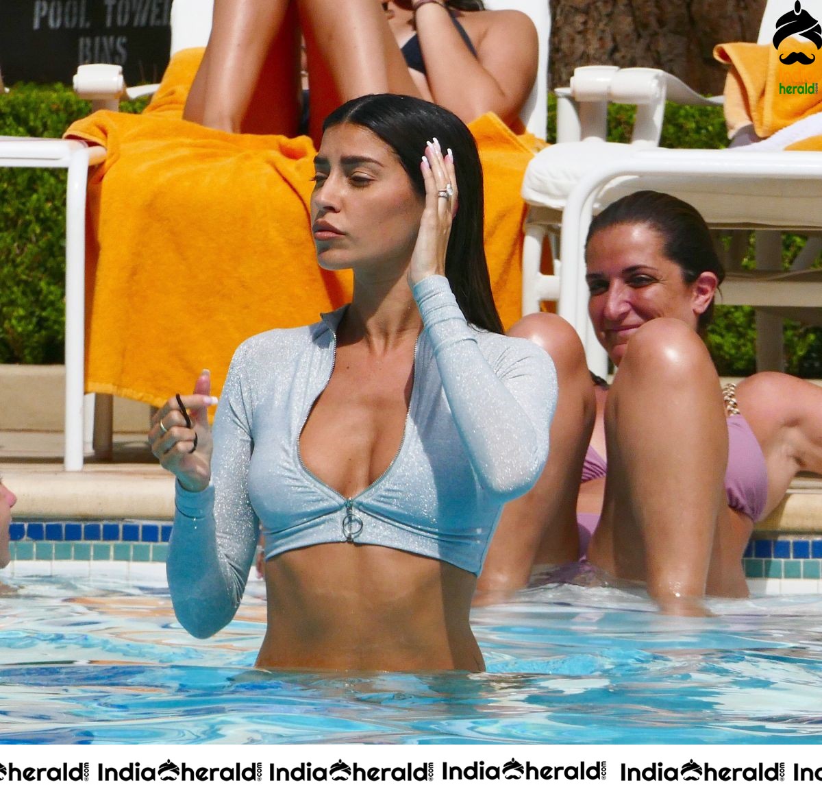 Nicole Williams in Bikini exposing her sexy back At her hotel in Las Vegas