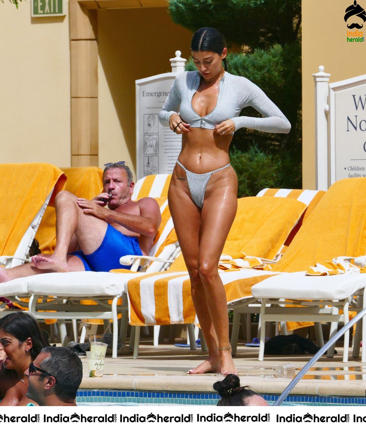 Nicole Williams in Bikini exposing her sexy back At her hotel in Las Vegas