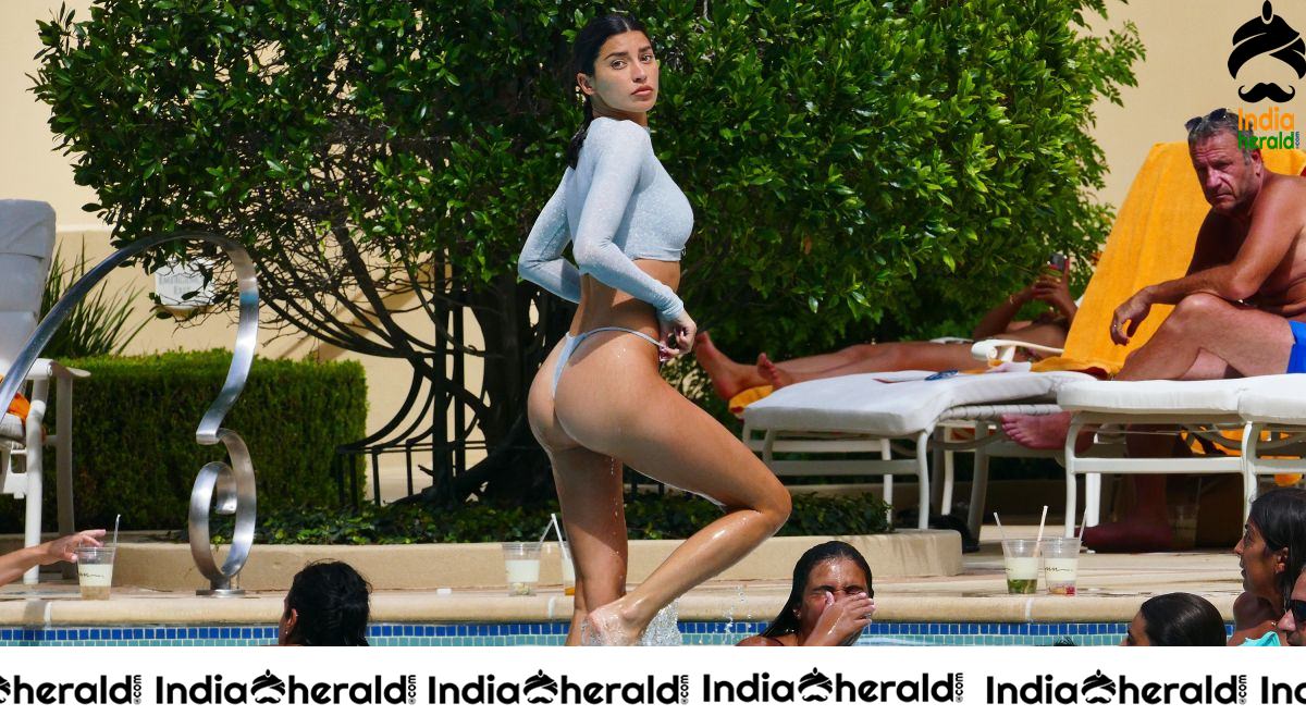 Nicole Williams in Bikini exposing her sexy back At her hotel in Las Vegas