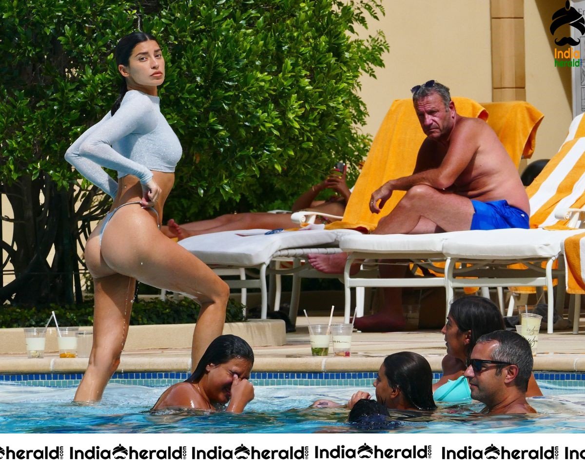 Nicole Williams in Bikini exposing her sexy back At her hotel in Las Vegas