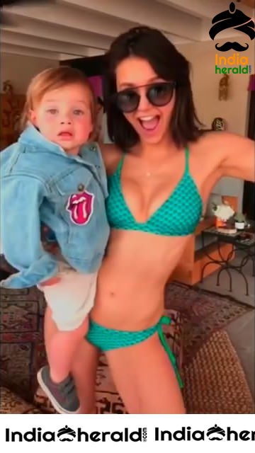 Nina Dobrev Dancing in Bikini with a Baby