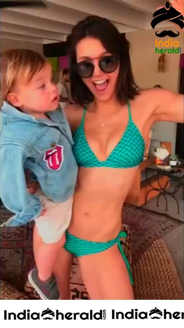 Nina Dobrev Dancing in Bikini with a Baby