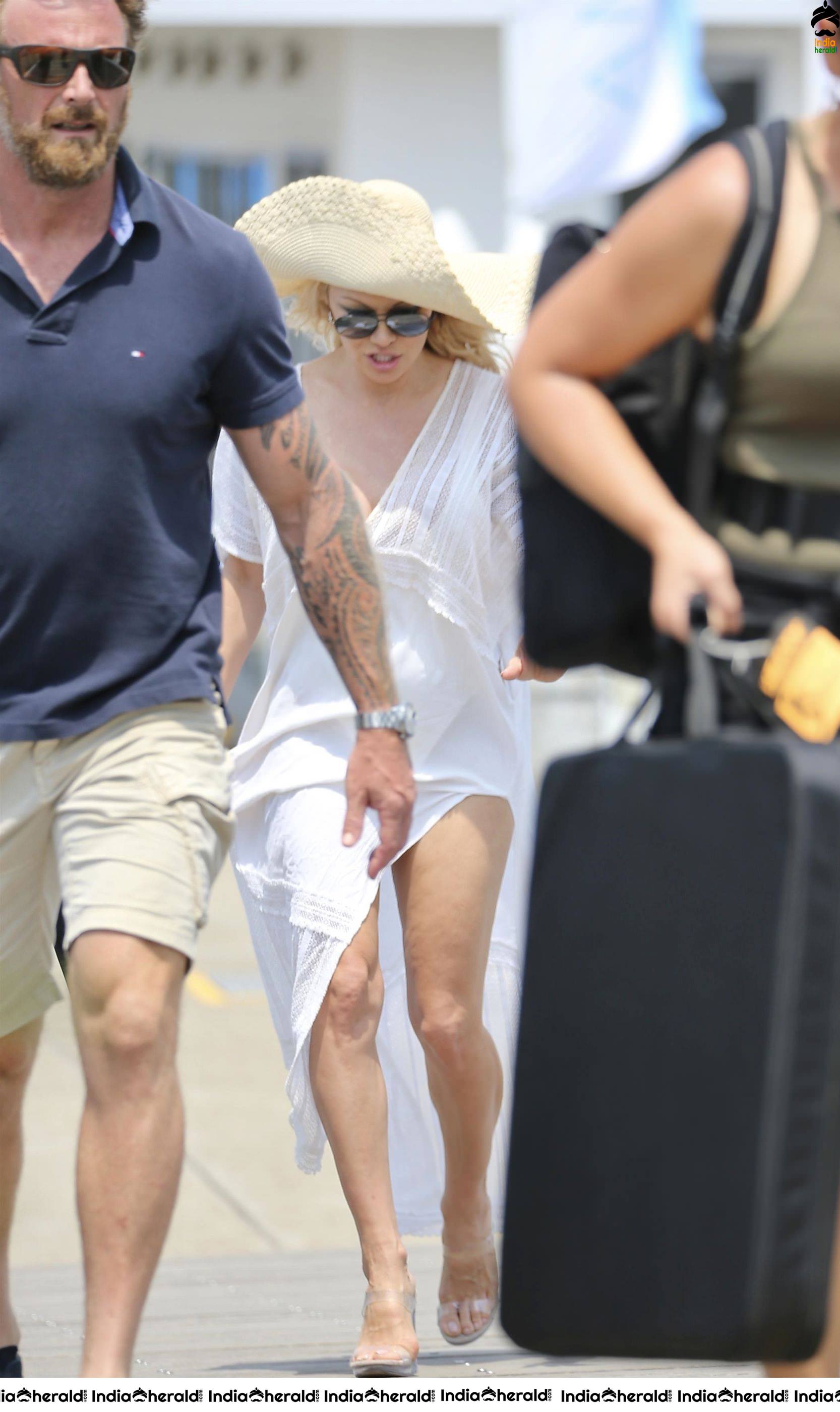 Pamela Anderson Poses in swimsuit for a photoshoot on the Gold Coast Australia