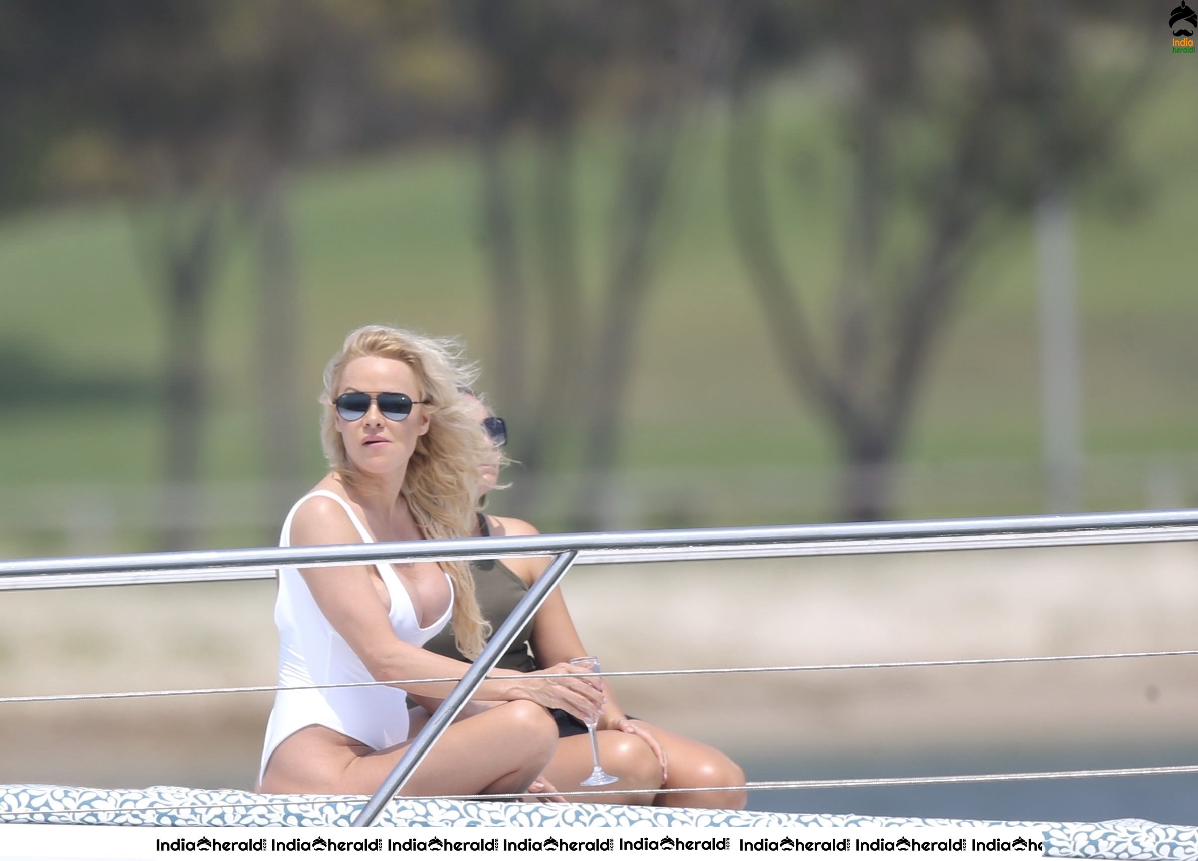 Pamela Anderson Poses in swimsuit for a photoshoot on the Gold Coast Australia