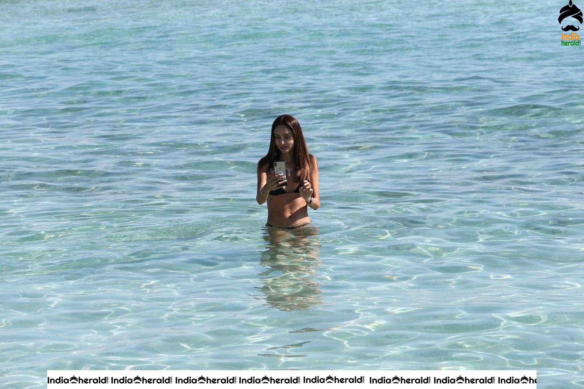 Patricia Contreras takes a quick dip in the water while at the beach in Miami