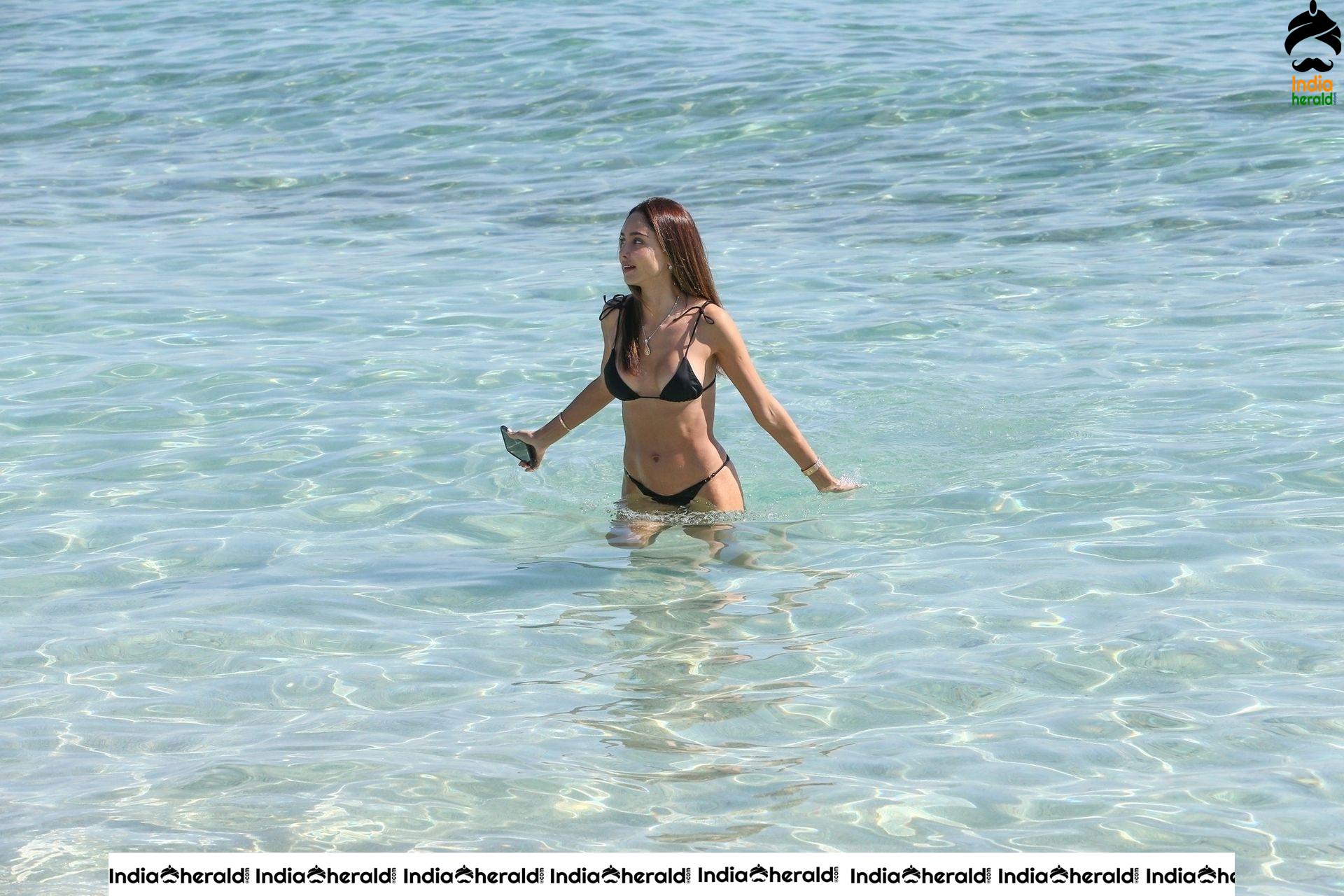 Patricia Contreras takes a quick dip in the water while at the beach in Miami