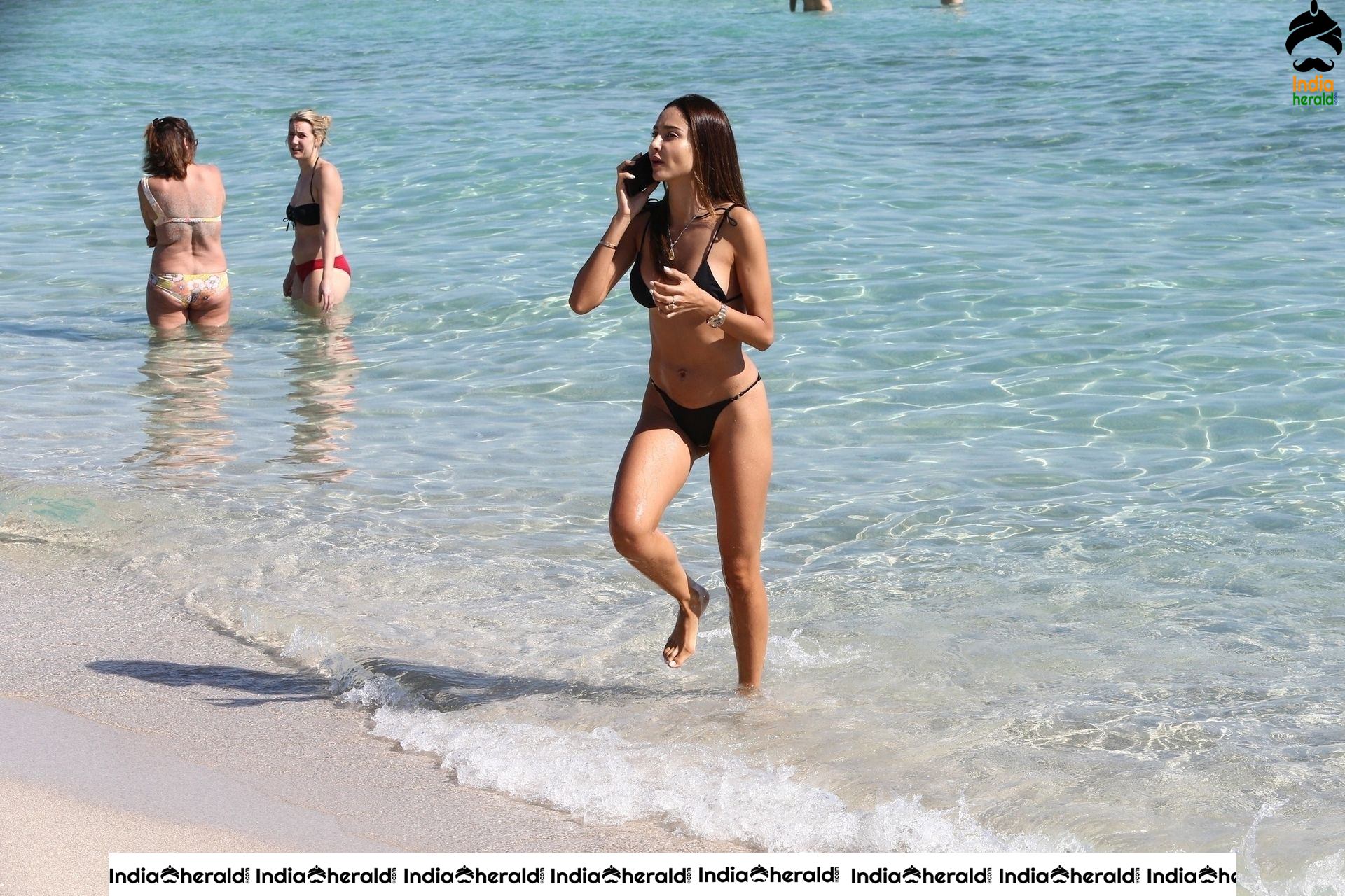 Patricia Contreras takes a quick dip in the water while at the beach in Miami