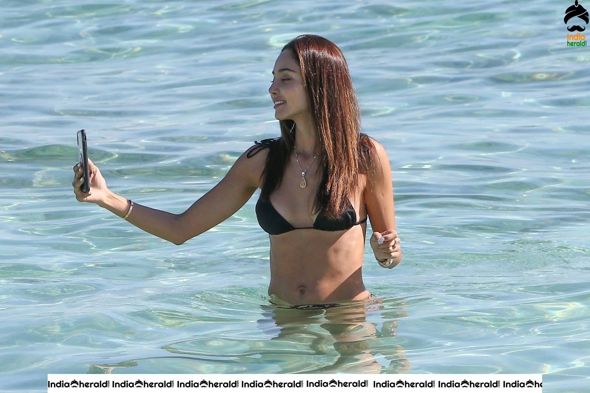 Patricia Contreras takes a quick dip in the water while at the beach in Miami