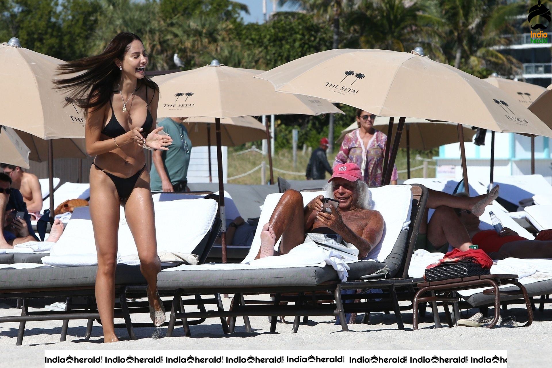 Patricia Contreras takes a quick dip in the water while at the beach in Miami