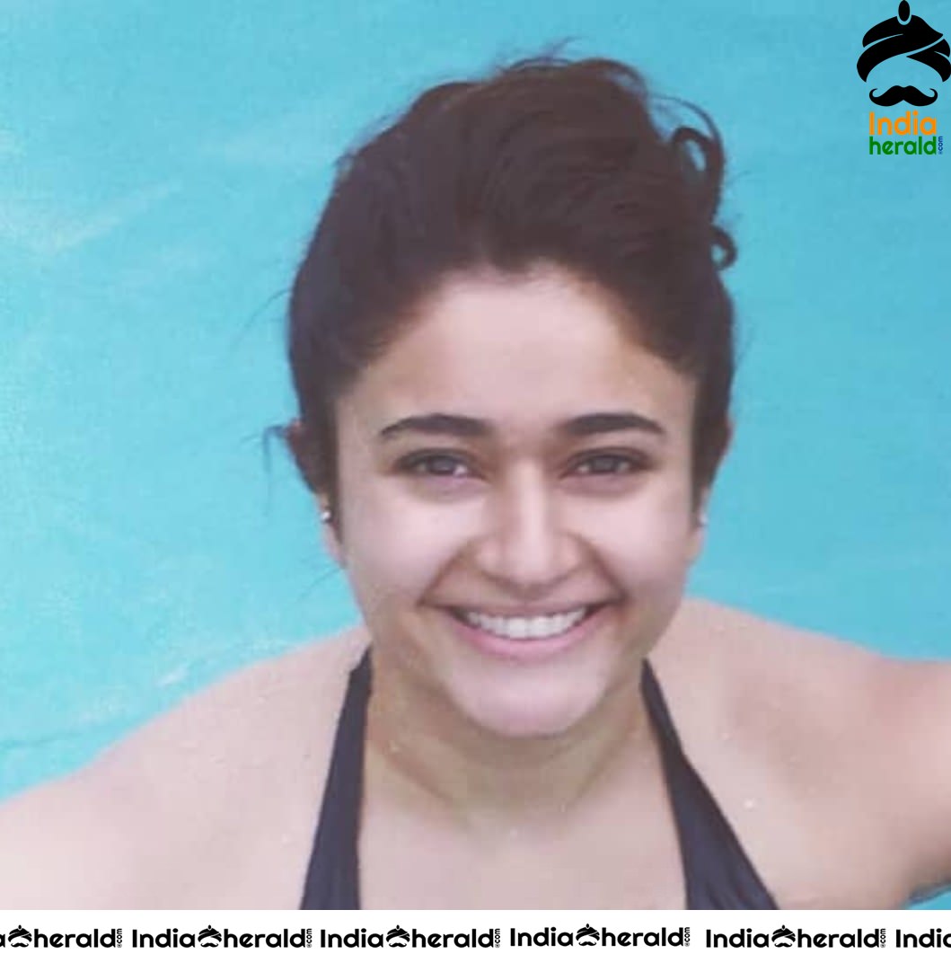 Poonam Bajwa Caught in a Black Bikini at a Pool