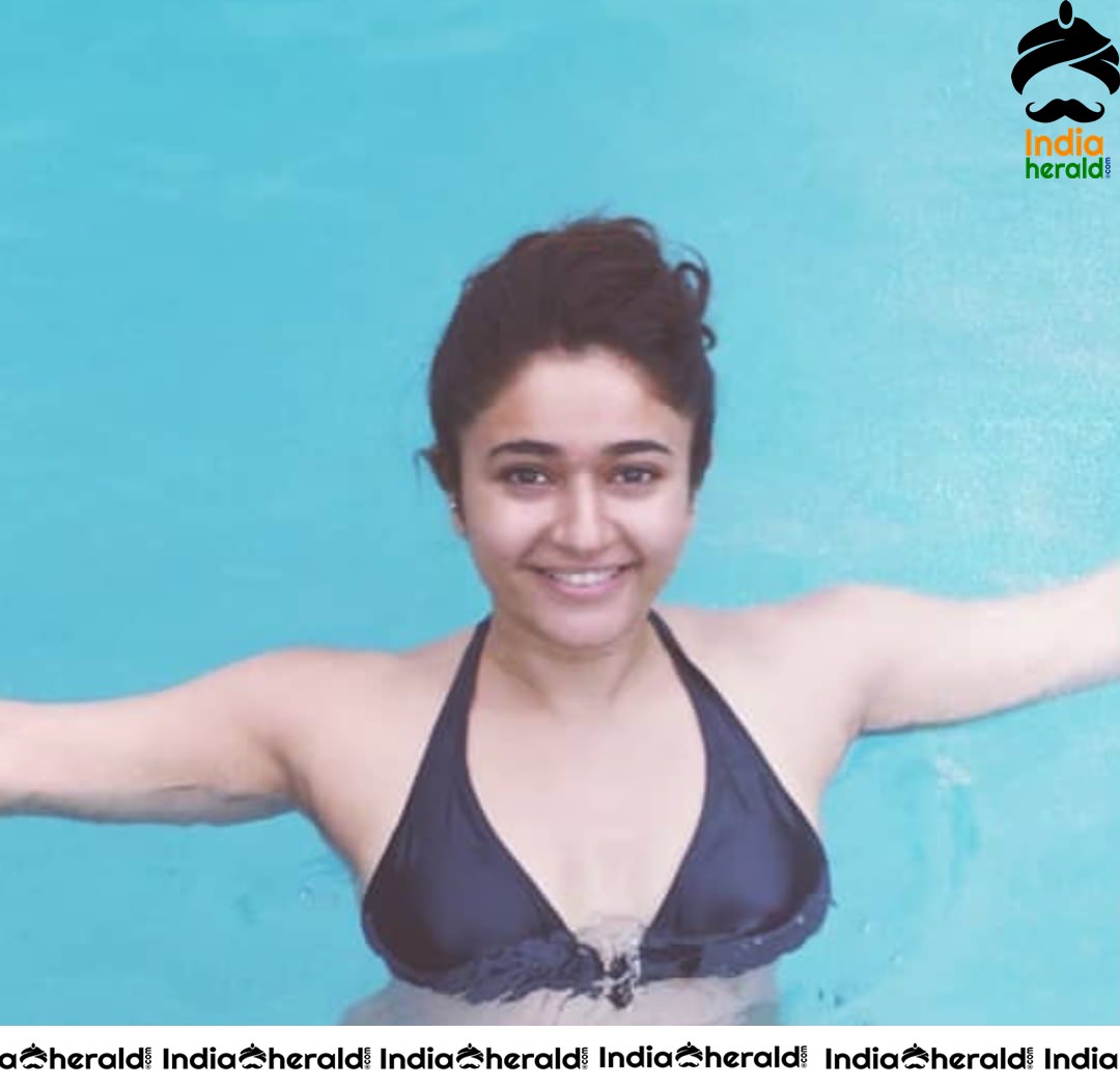 Poonam Bajwa Caught in a Black Bikini at a Pool