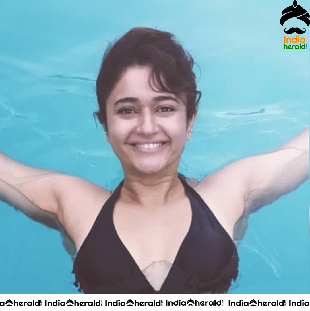 Poonam Bajwa Caught in a Black Bikini at a Pool