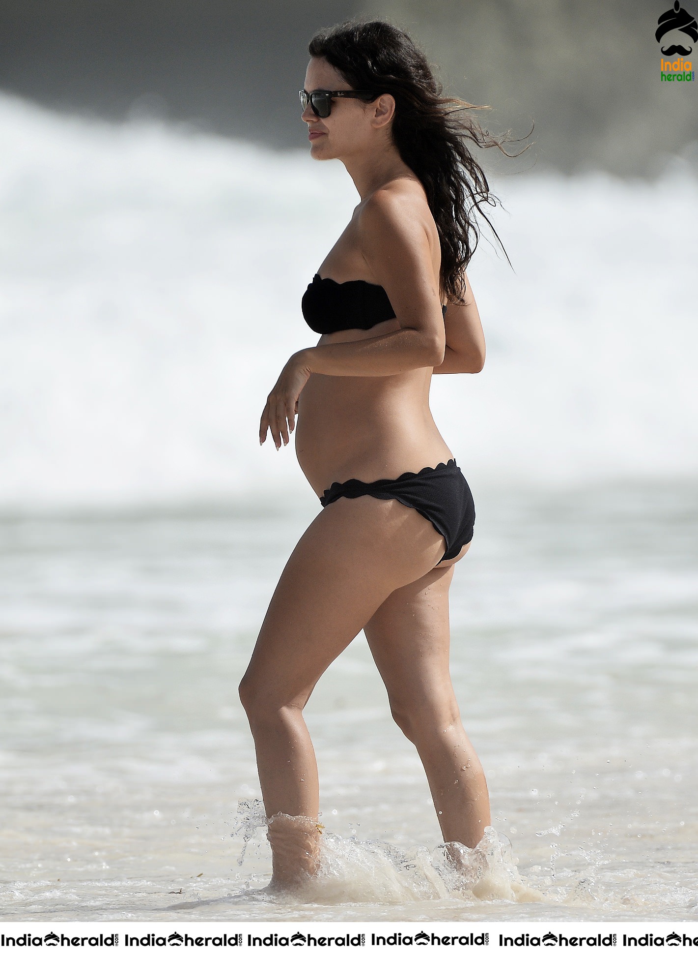 Rachel Bilson wearing a Black Bikini and flaunting her bump at a beach in Barbados Set 1
