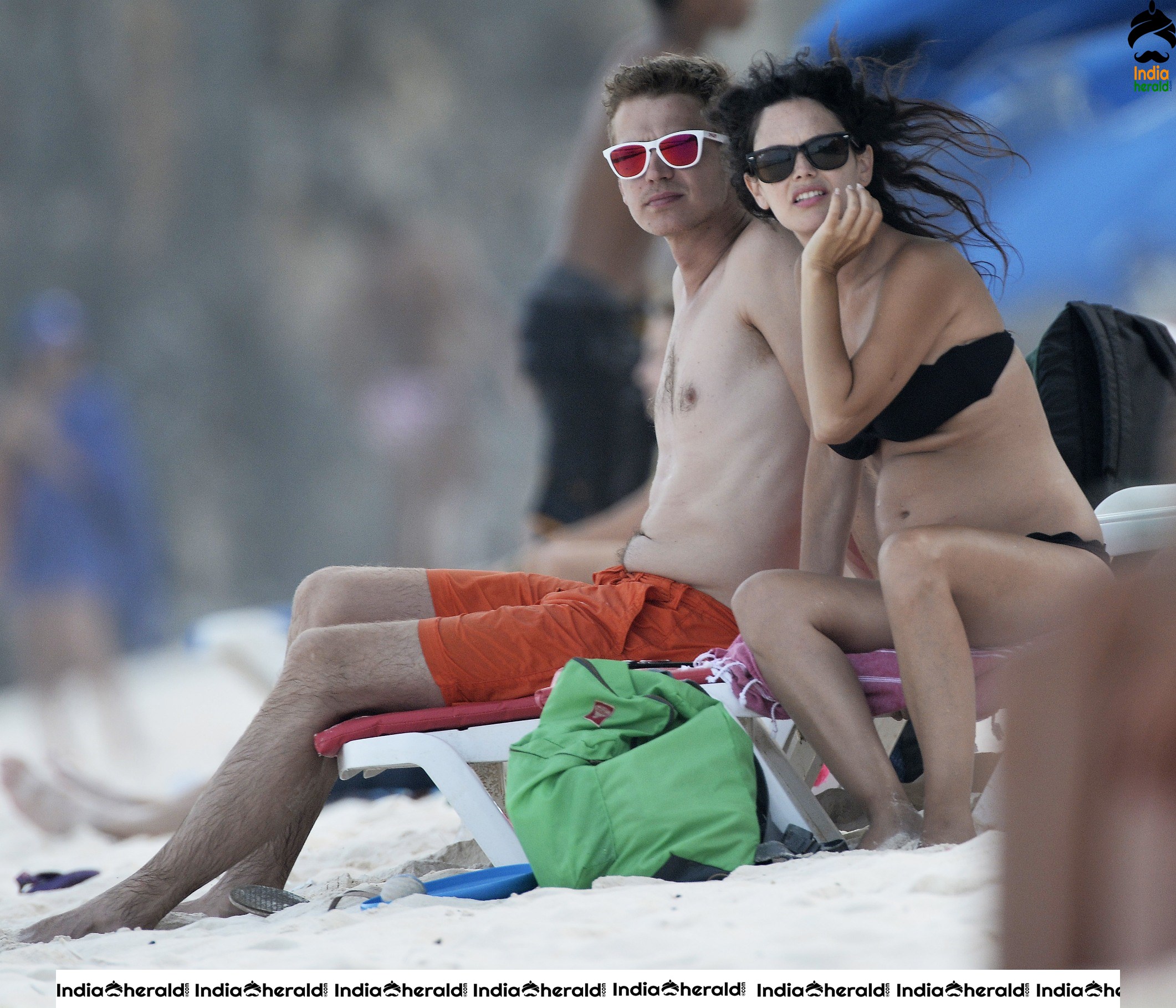 Rachel Bilson wearing a Black Bikini and flaunting her bump at a beach in Barbados Set 1