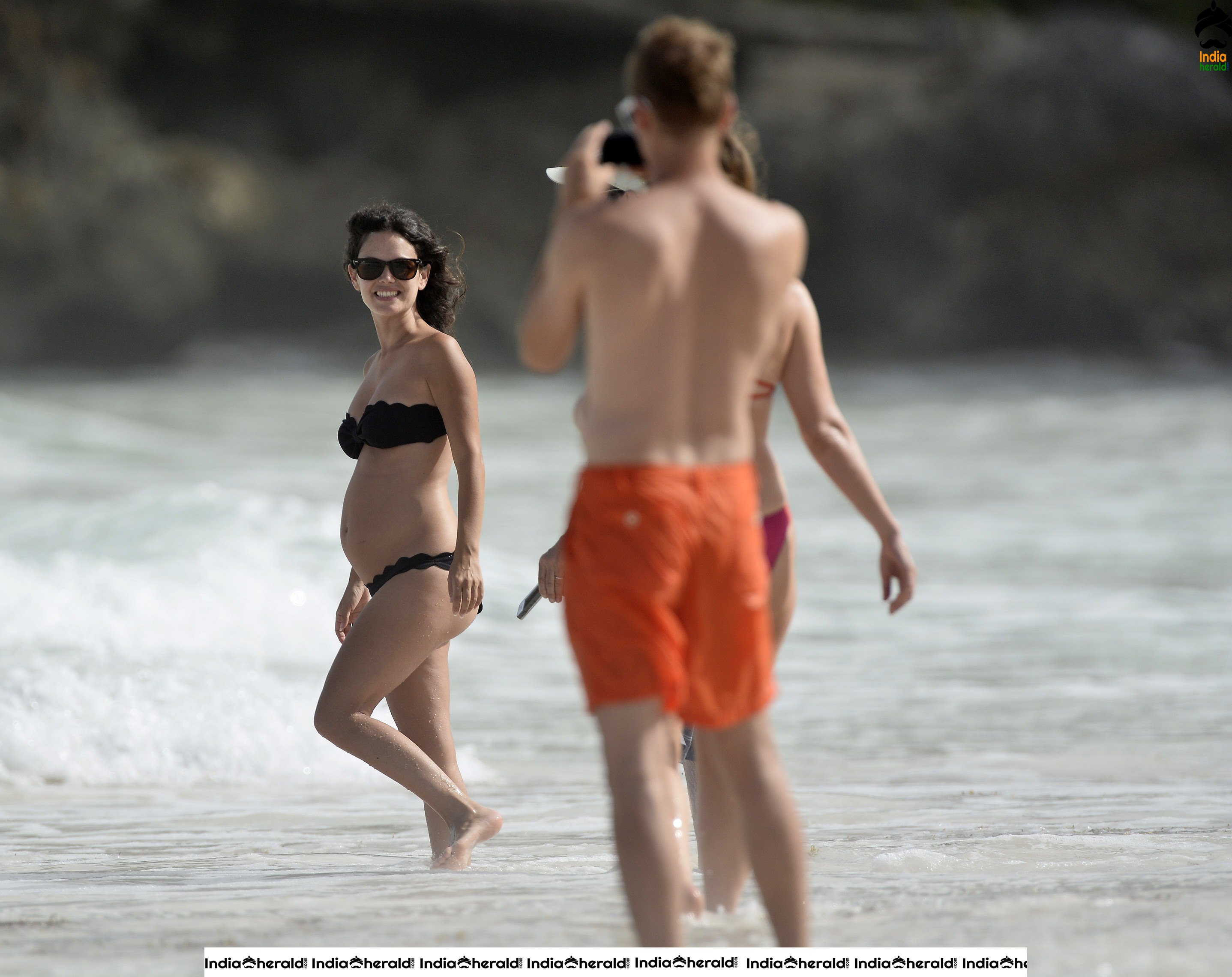 Rachel Bilson wearing a Black Bikini and flaunting her bump at a beach in Barbados Set 2