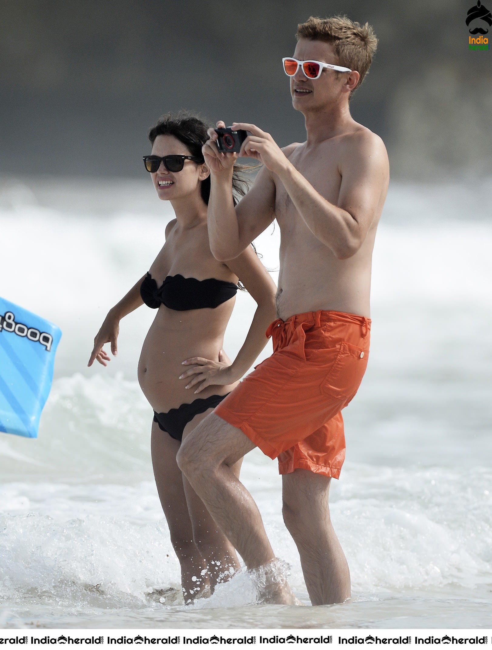 Rachel Bilson wearing a Black Bikini and flaunting her bump at a beach in Barbados Set 2