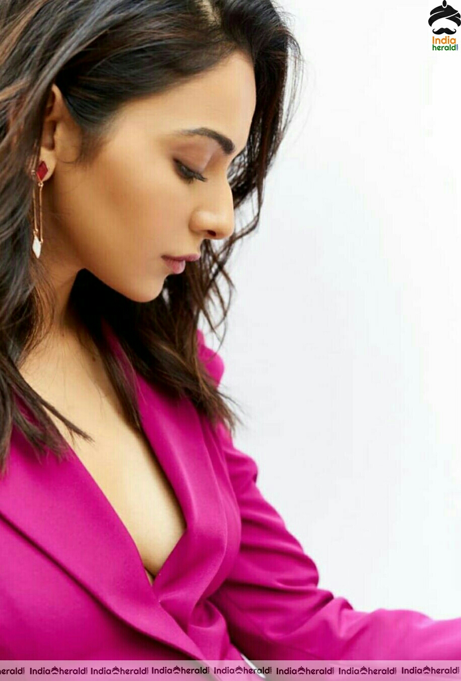 Rakul Preet Hot Cleavage Show In Pink coat