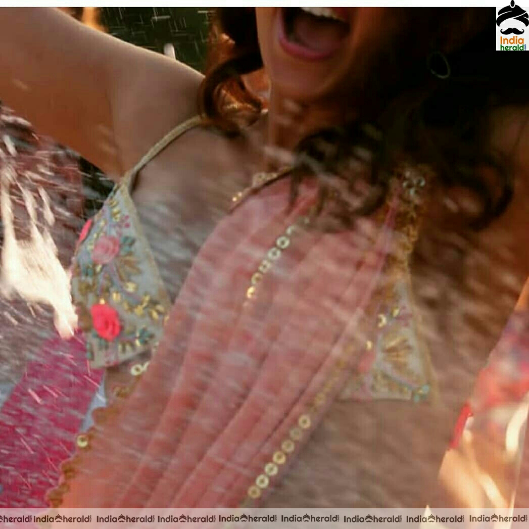 Rakul Preet in saree and brassiere kinda blouse exposing her inner beauty