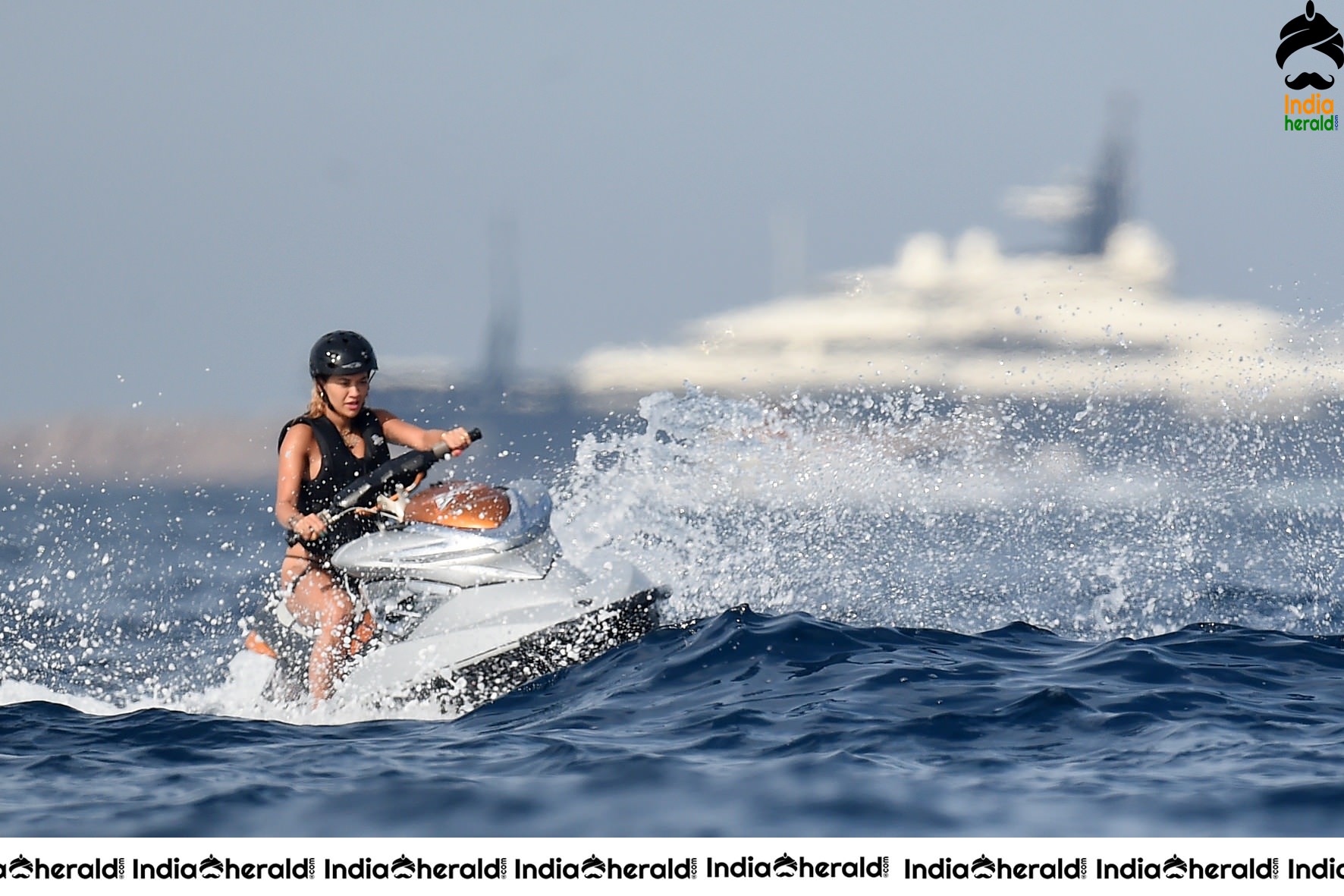 Rita Ora in a Bikini while having fun at Porto Cervo