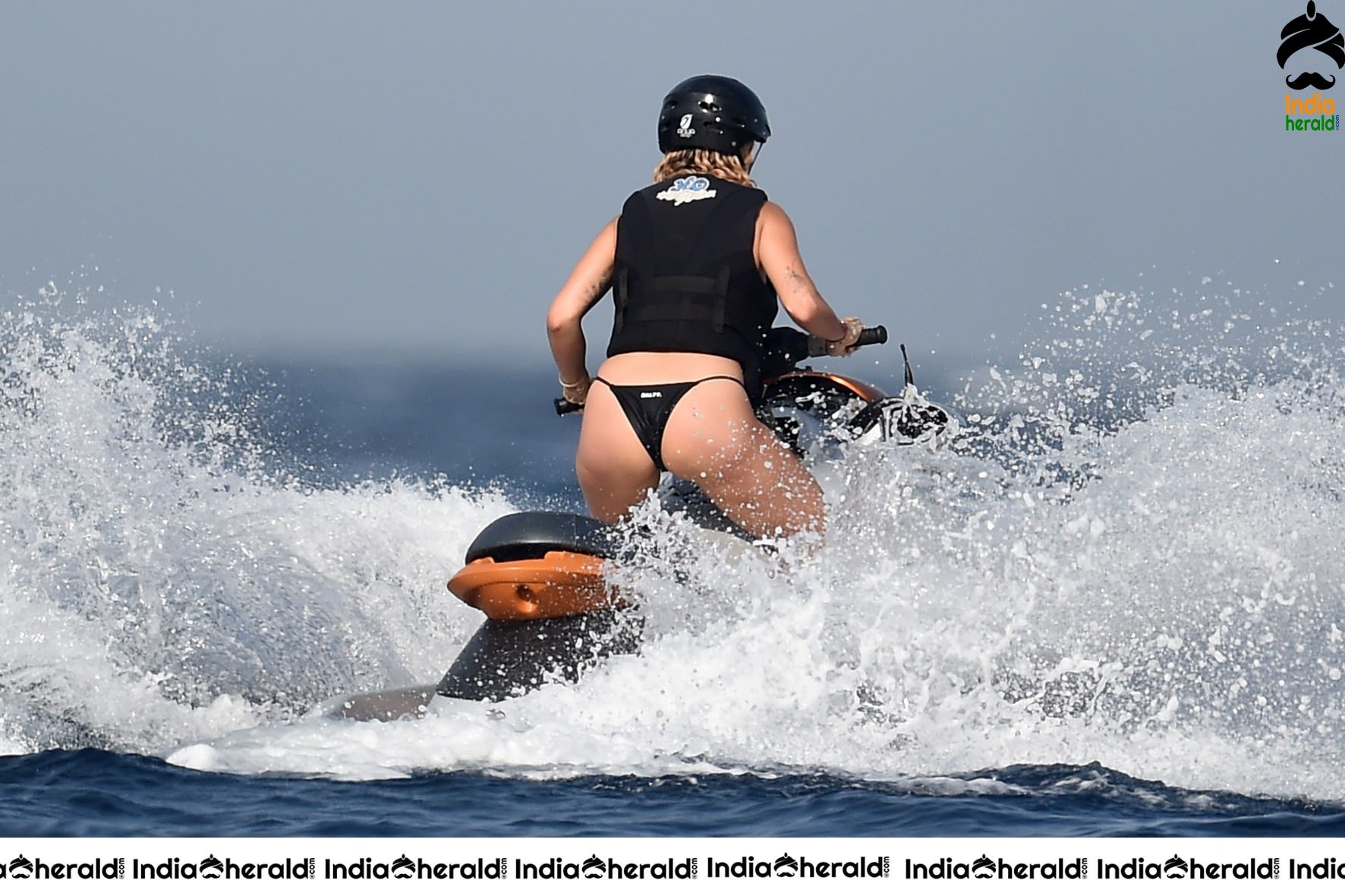 Rita Ora in a Bikini while having fun at Porto Cervo