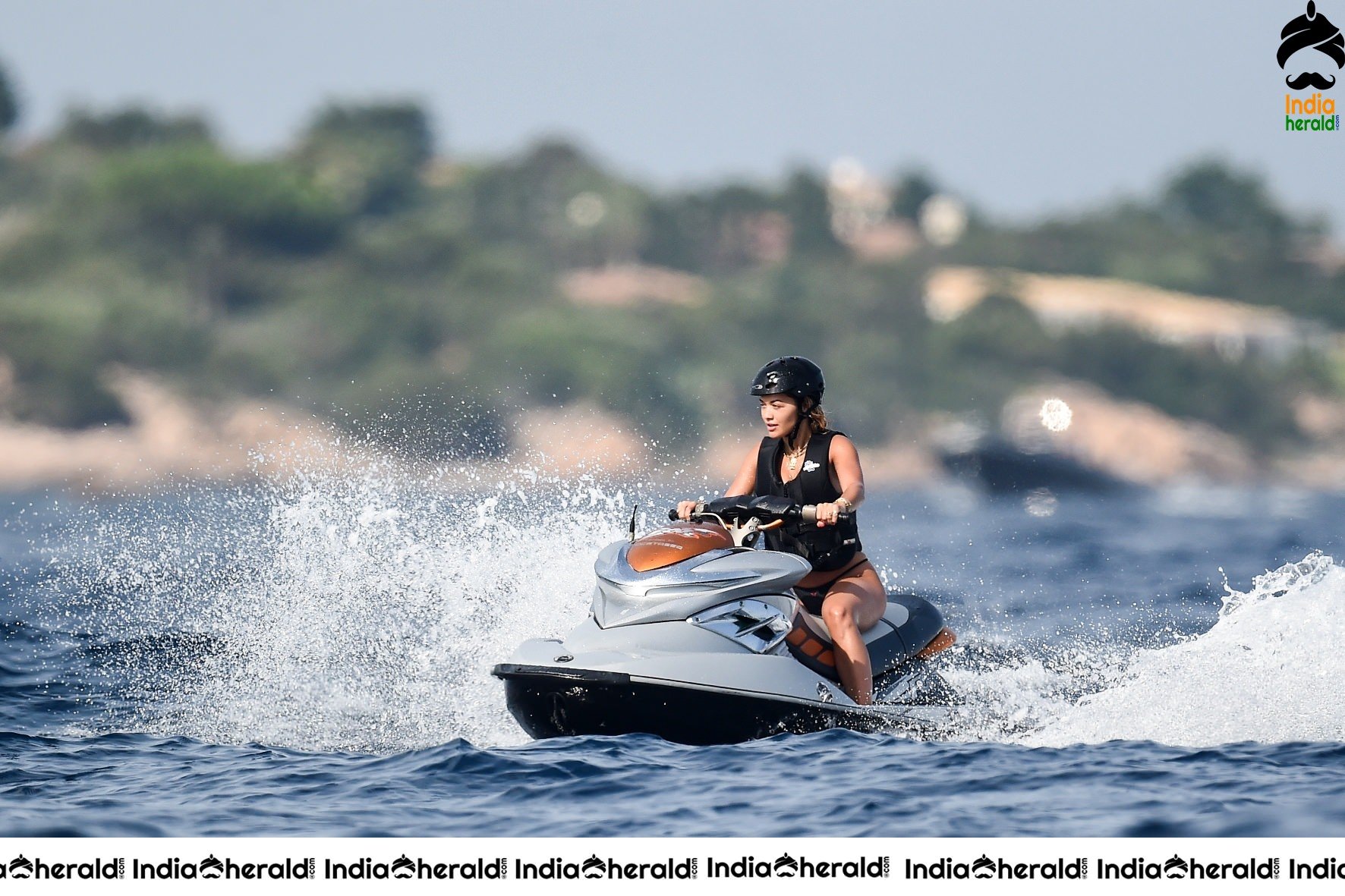 Rita Ora in a Bikini while having fun at Porto Cervo