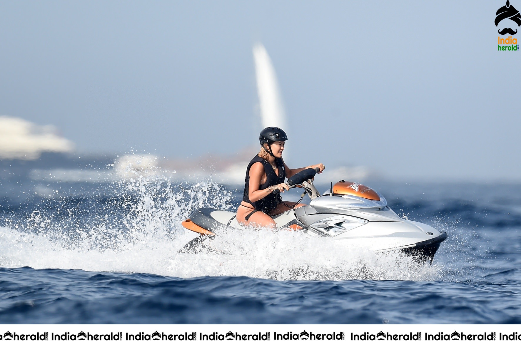 Rita Ora in a Bikini while having fun at Porto Cervo