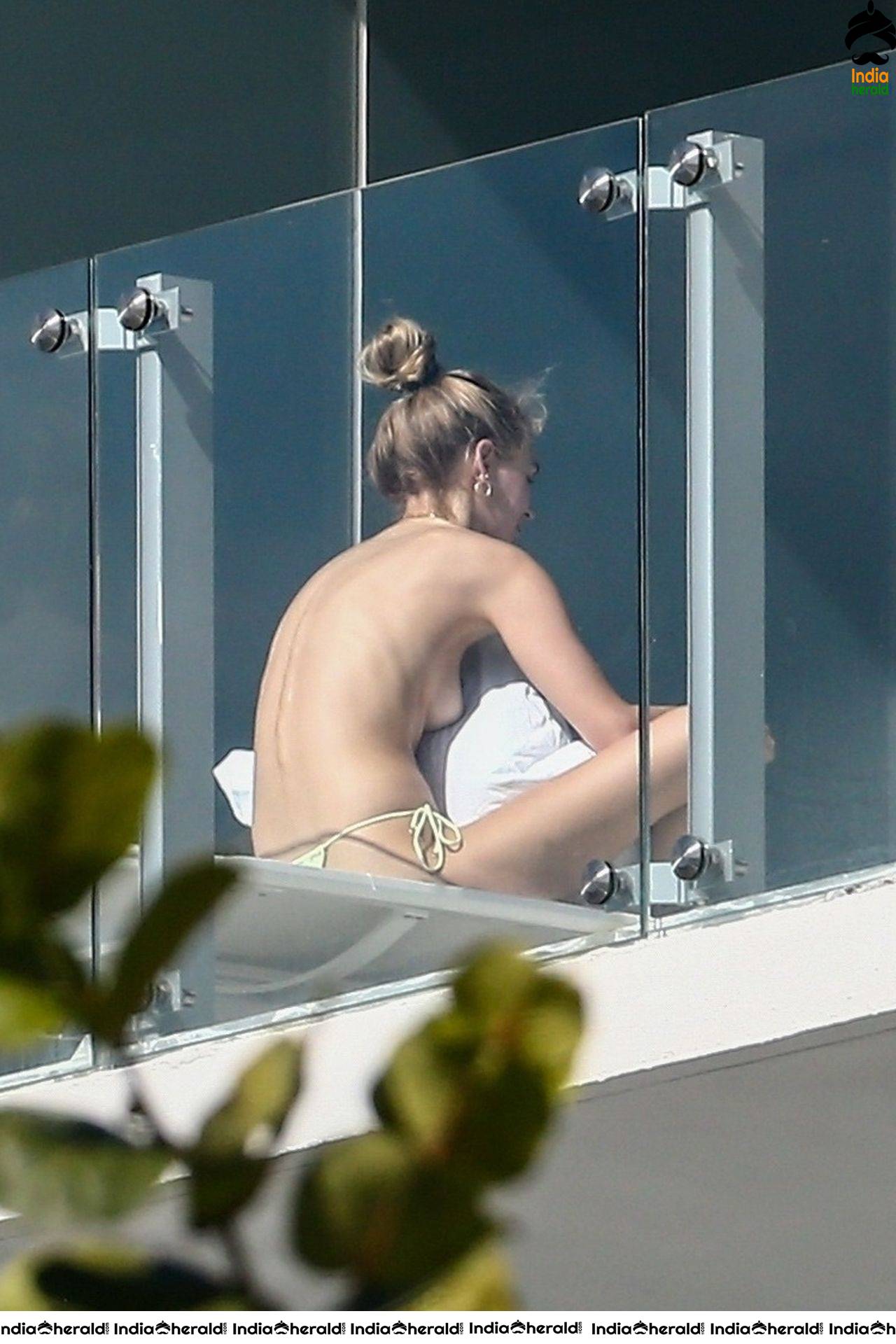 Roosmarijn de Kok sunbathing in Bikini off her balcony in Miami