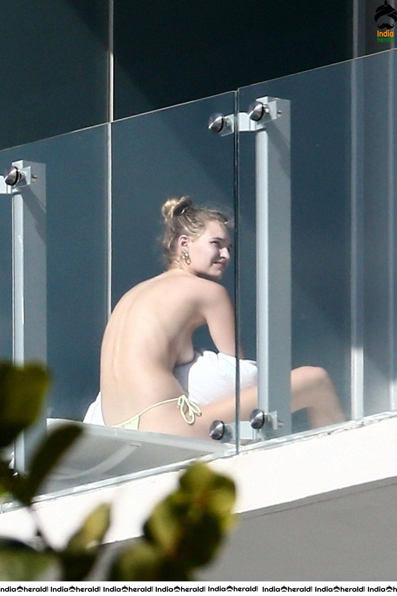 Roosmarijn de Kok sunbathing in Bikini off her balcony in Miami