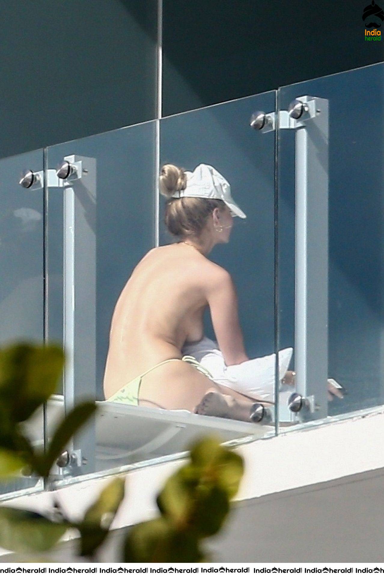 Roosmarijn de Kok sunbathing in Bikini off her balcony in Miami