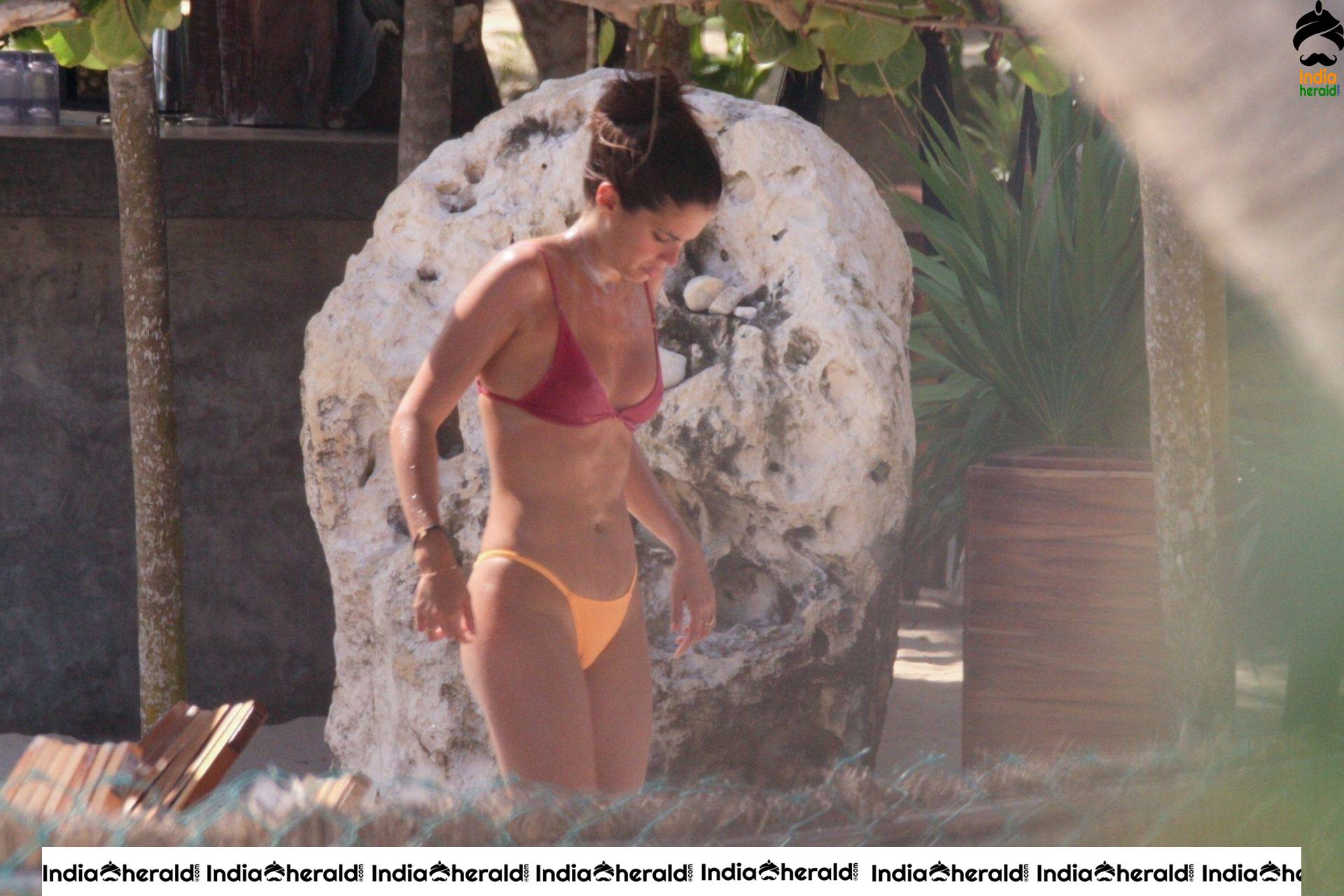 Sara Sampaio afternoon tanning session in Bikini at the pool in Tulum