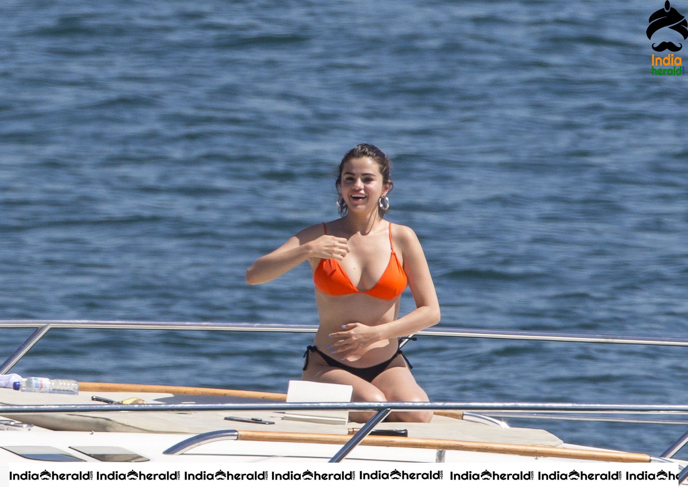 Selena Gomez in Orange Bra and Black Panty on a Yacht in Sydney Set 1