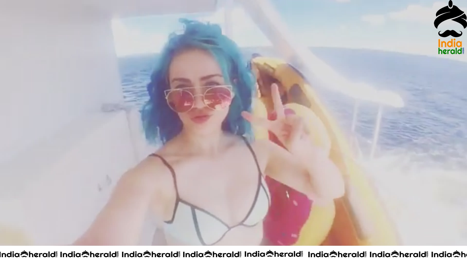 Skye Sweetnam in Blue And Black Bikini Top On A Boat