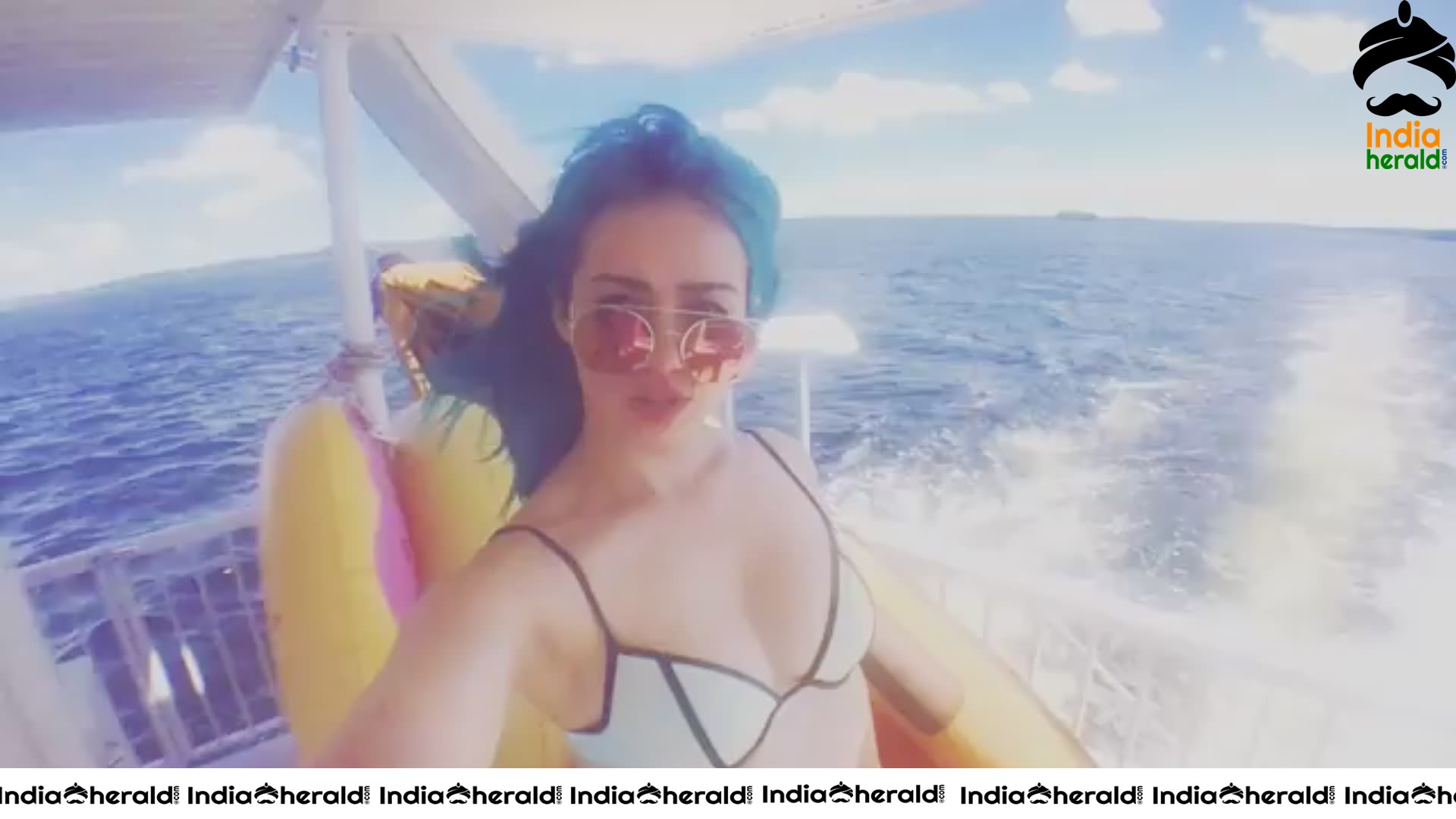 Skye Sweetnam in Blue And Black Bikini Top On A Boat