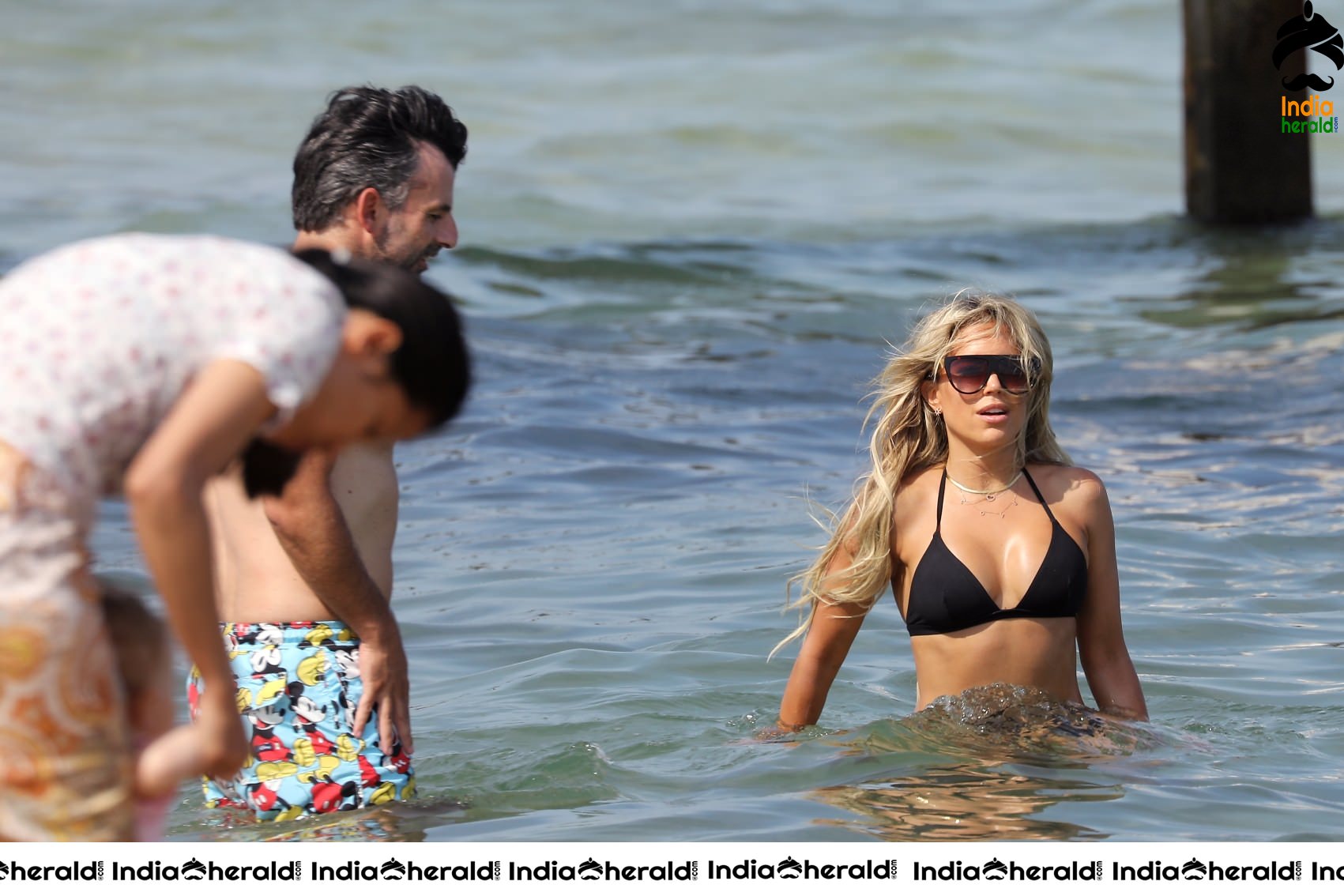 Sylvie Meis in Bikini and Enjoying with Boyfriend by bathing in the Beach