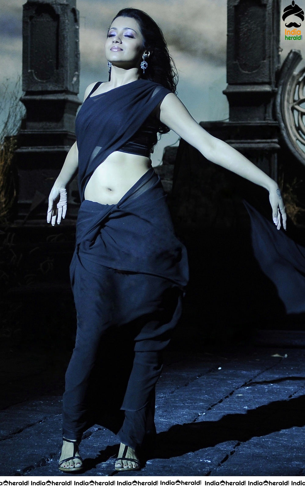 Trisha Raises the Heat by Exposing her Deep Navel in Black Transparent Saree