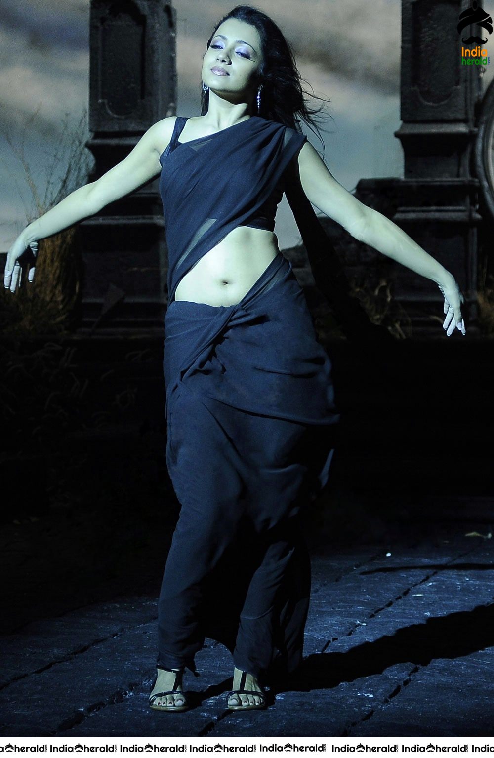 Trisha Raises the Heat by Exposing her Deep Navel in Black Transparent Saree