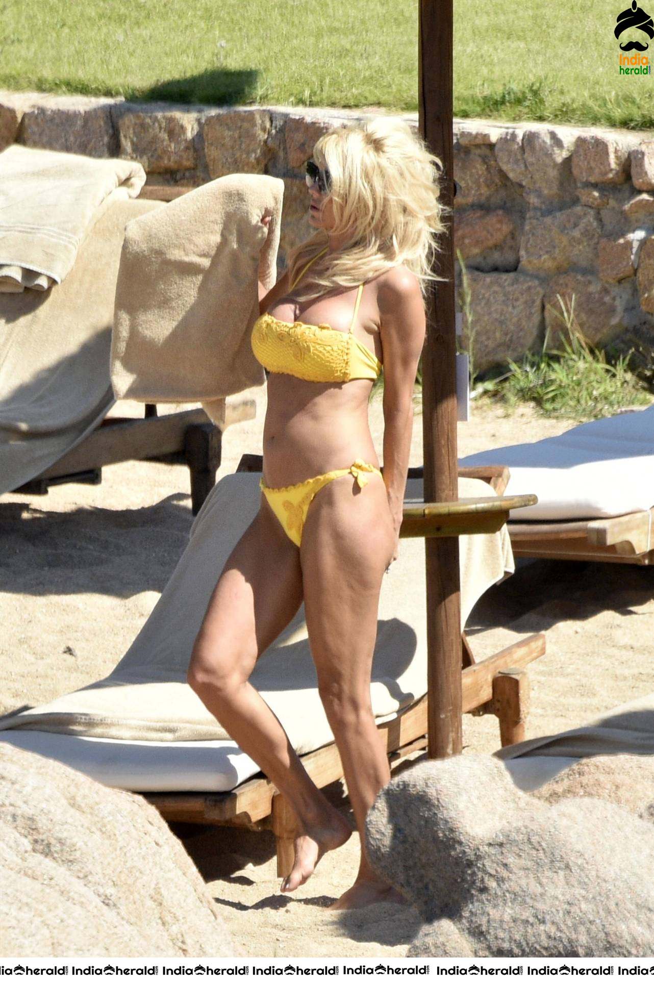 Victoria Silvstedt caught in Bikini on the beach in Porto Cervo