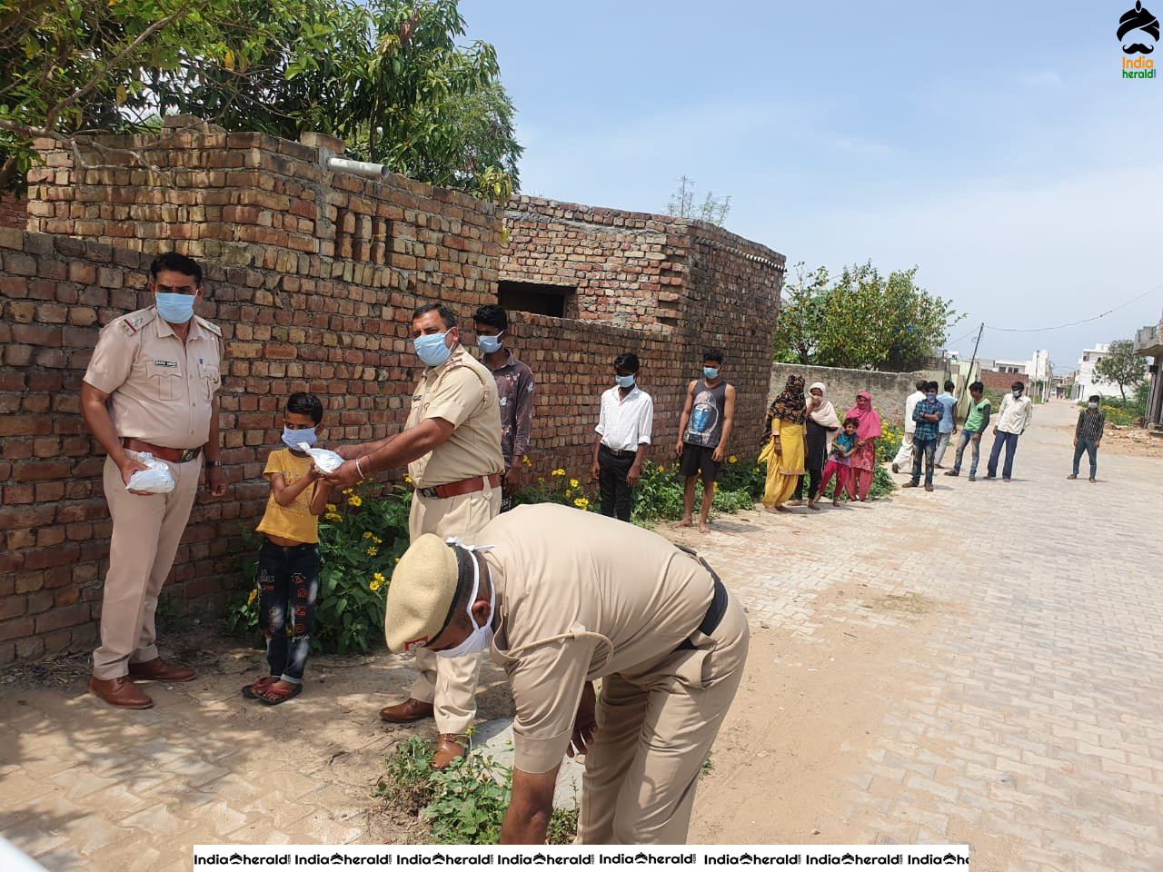 Personnel of Haryana Police distributed food among the needy amid the COVID 19 Lockdown