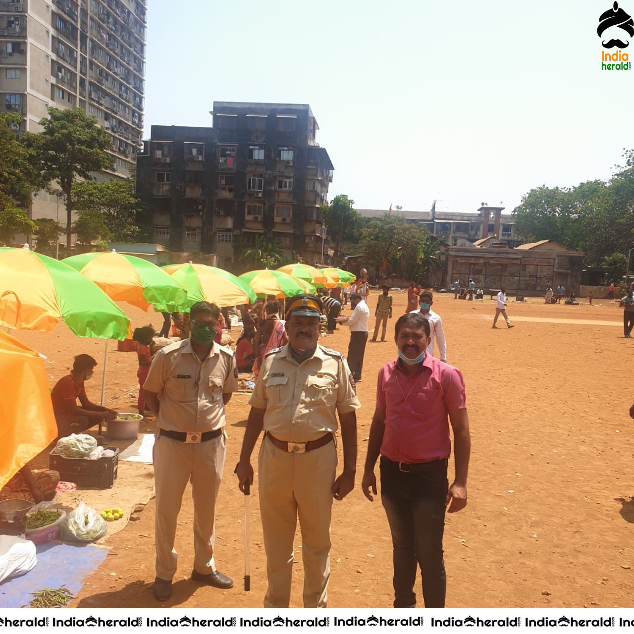 Police distributed umbrellas to vegetable vendors in open ground as a precaution against Corona Virus