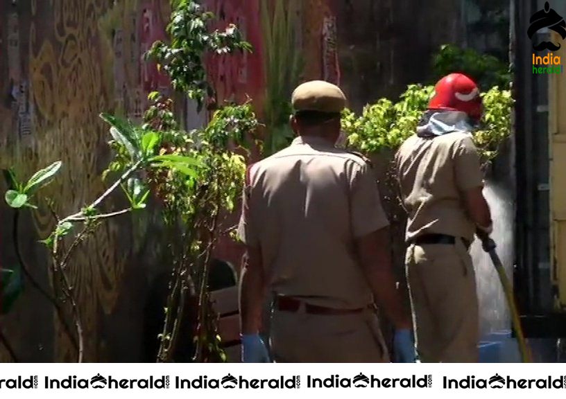 Police personnel sanitize Nizamuddin Markaz area which emerged as a Corona Virus hotspot