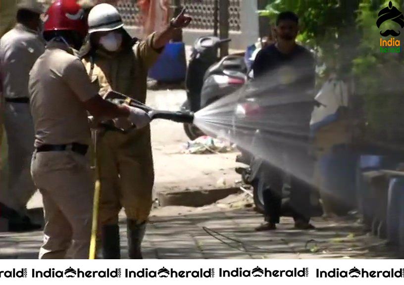 Police personnel sanitize Nizamuddin Markaz area which emerged as a Corona Virus hotspot