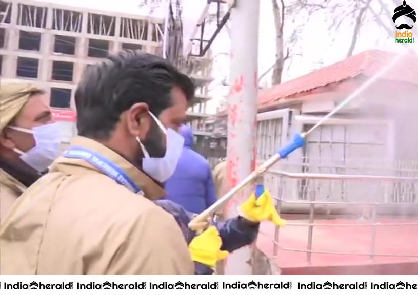Srinagar Municipal Corporation workers sanitize different areas in Srinagar in view of Corona Virus Pandemic