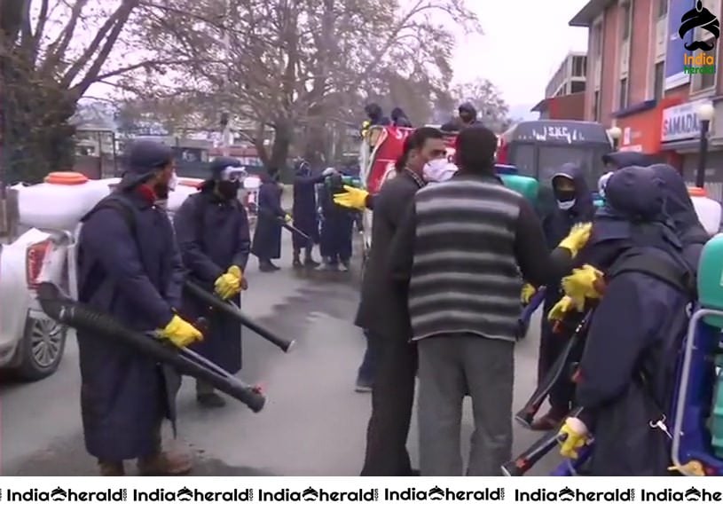 Srinagar Municipal Corporation workers sanitize different areas in Srinagar in view of Corona Virus Pandemic